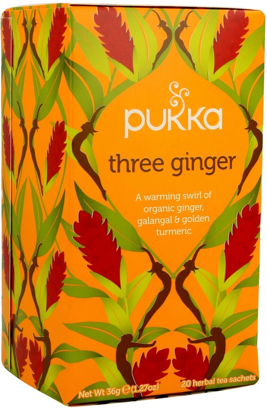 Pukka three ginger thee verpakking met oranje achtergrond en afbeeldingen van gemberbloemen en bladeren.