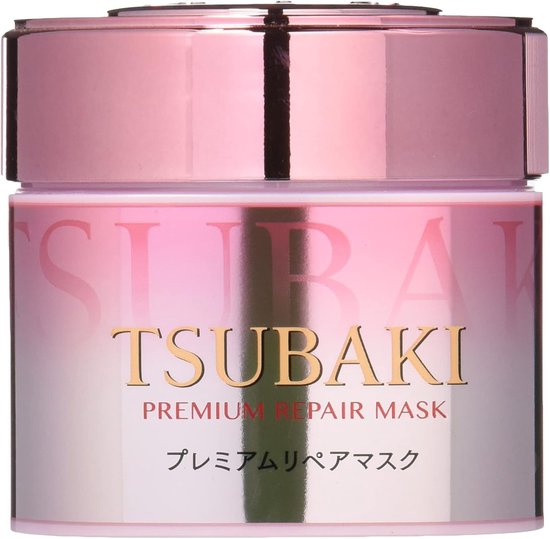 Roze en goudkleurige pot met 'TSUBAKI PREMIUM REPAIR MASK' tekst.