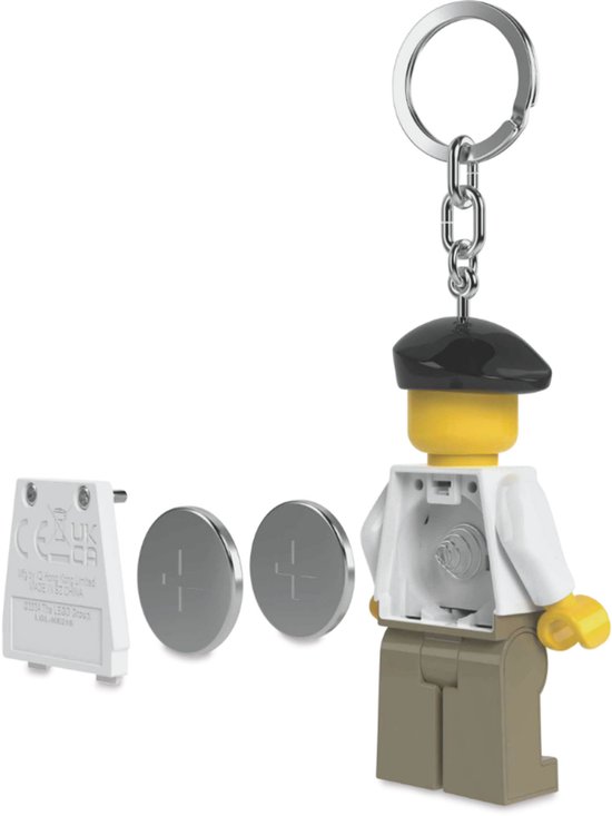 Lego-kunstenaarssleutelhanger met baret, wit schildershemd met verfvlekken, beige broek, en losse batterijen en achterkant.