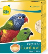 Gele verpakking met "CéDé" logo, twee kleurrijke loripapegaaien, "PREMIUM Lorifood 5kg" en een eidooier.
