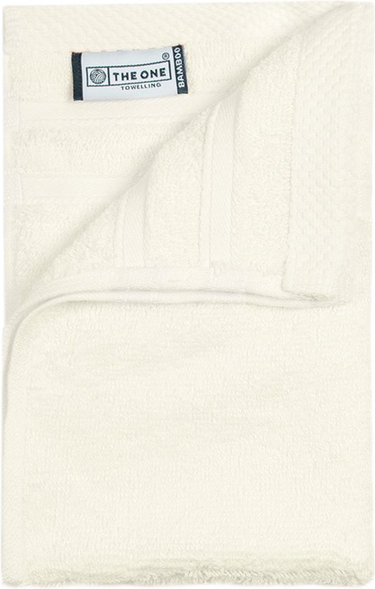Serviettes d'invités en tissu éponge de couleur crème avec étiquette 'The One Towelling', en bambou/coton.