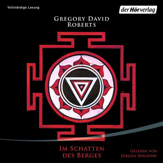 Boekomslag met rode en witte mandala-achtige vorm en tekst 'Im Schatten des Berges'.