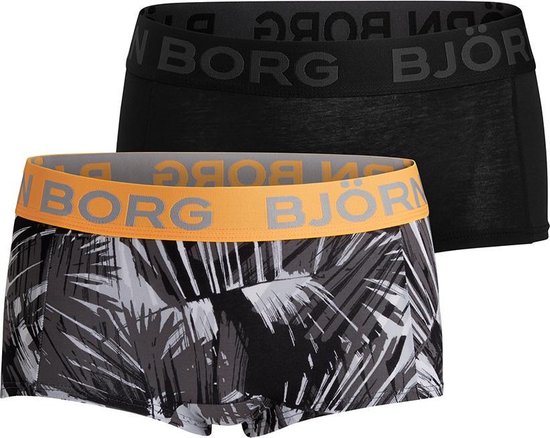 Set van twee boxershorts: één effen zwarte en één met zwart-wit palmbladmotief en oranje tailleband.