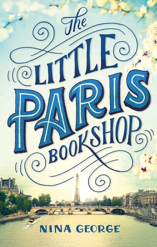 Boekcover 'The Little Paris Bookshop' met sierlijke belettering en een afbeelding van de Eiffeltoren en de Seine.