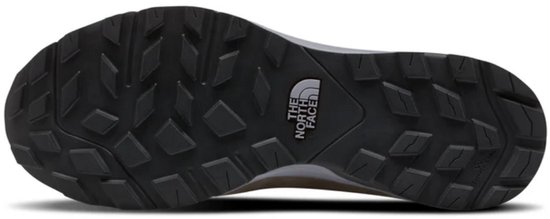 Zwarte profielzool van de wandelschoen met het logo 'The North Face'.