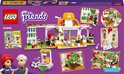 Achterkant van de LEGO Friends café set. Toont de set, karakters en speelmogelijkheden, waaronder een foodtruck en terras.