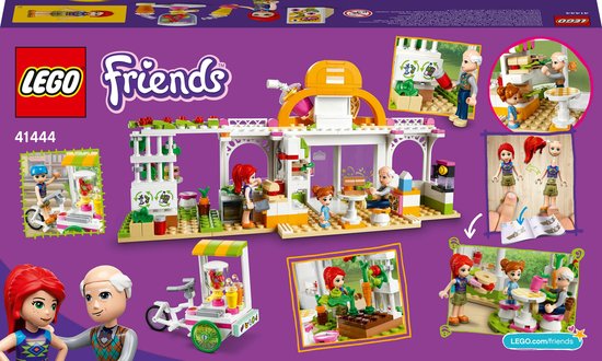 Achterkant van de LEGO Friends café set. Toont de set, karakters en speelmogelijkheden, waaronder een foodtruck en terras.
