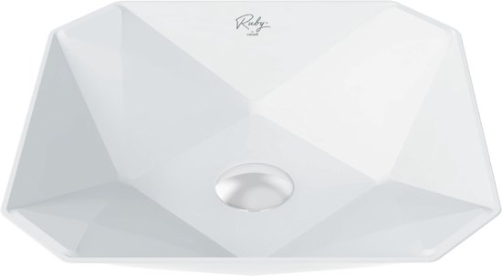 Witte keramische waskom met facetontwerp en een cirkelvormige afvoer. Het logo van Ruby is zichtbaar.