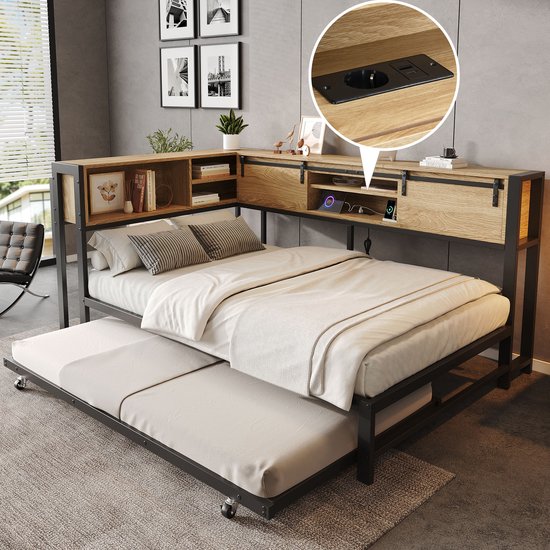 Bedframe van zwart metaal met lichte houtlook opbergkop en uittrekbed, met ingebouwde stopcontacten.