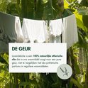 Witte was hangt buiten in het groen; tekst legt uit dat lavendelolie zorgt voor een pure, natuurlijke geur.