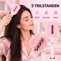Roze elektrische haarborstel met 3 trilstanden: zacht, normaal en intens.