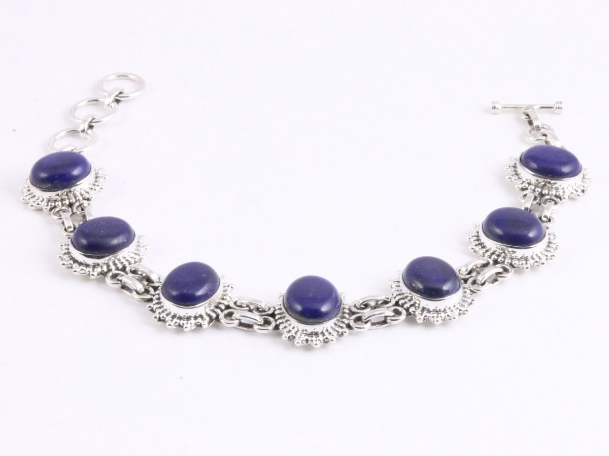 Bewerkte zilveren schakelarmband met grote lapis lazuli stenen