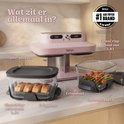 Ninja airfryer met glazen schalen, crispplaten en bewaardeksels uitgestald op een aanrecht met labels.