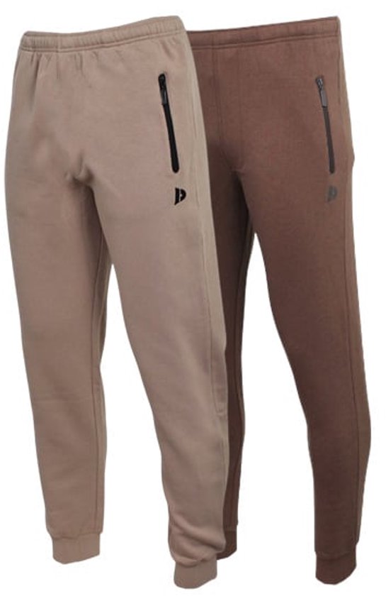 Twee joggingbroeken in taupe en bruin, voorzien van ritszakken en een subtiel Donnay-logo.