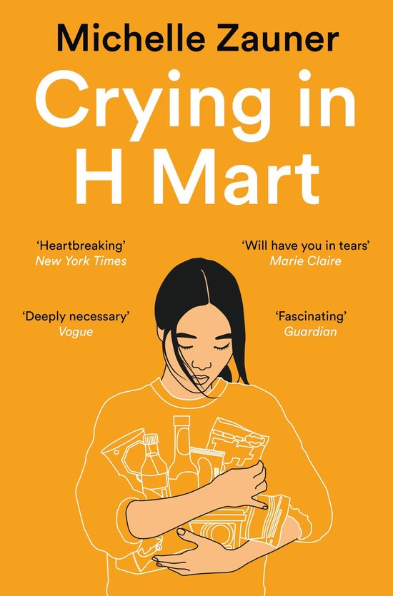 Livre "Crying in H Mart" avec une illustration d'une femme tenant des produits d'épicerie, sur fond orange.