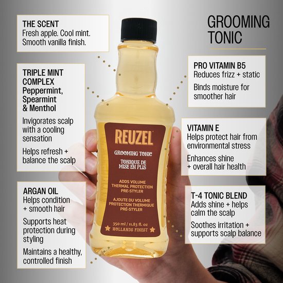 Hand die fles Reuzel Grooming Tonic vasthoudt met gedetailleerde tekst over ingrediënten en geurprofiel.