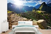 Behang - Fotobehang Avondzonnestraal over Machu Picchu Peru - Breedte 330 cm x hoogte 220 cm