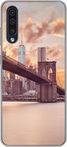 Geschikt voor Samsung Galaxy A50 hoesje - Brooklyn Brug en de skyline van New York tijdens zonsondergang - Siliconen Telefoonhoesje