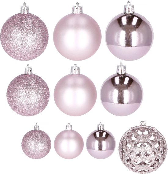 Verschillende roze kerstballen, glinsterend, mat en glanzend, naast elkaar.