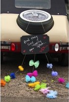 Krijtbord met pompoms en strikjes