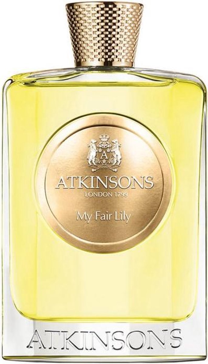 Een glazen parfumfles met een gouden, gestructureerde dop. Het heldere, gele parfum wordt omlijst door een gouden ovaal met 'ATKINSONS LONDON 1799 My Fair Lily'.