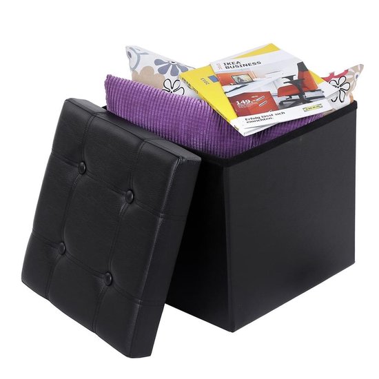 Zwarte opbergkruk met paarse deken en tijdschriften.