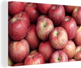 Un tas de pommes rouges colorées Toile 180x120 cm - Tirage photo sur Toile (Décoration murale salon / chambre) XXL / Groot format!