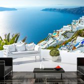 Fotobehangkoning - Behang - Vliesbehang - Fotobehang Uitzicht op Santorini - 100 x 70 cm