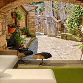 Fotobehangkoning - Behang - Vliesbehang - Fotobehang Toscaanse Steeg 3D - Toscane - Italië - Provincial alley in Tuscany - 100 x 70 cm