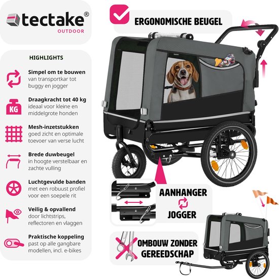 Grijze hondenfietskar met "ERGONOMISCHE BEUGEL". Hond kijkt vanuit de open rits. Inclusief oranje vlaggetjes.