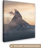 Canvas Schilderij Mistige Matterhorn bij Zermatt in Zwitserland. - 90x90 cm - Wanddecoratie