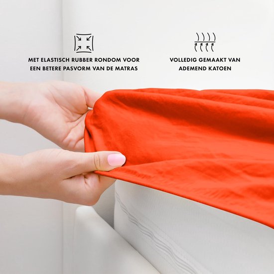 Drap housse orange, 100% coton, avec cordon élastique pour un meilleur ajustement.