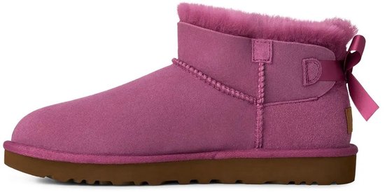 Paarse UGG laars, bruine zool, roze strik op de achterkant.