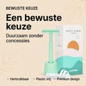 Mintgroen scheerapparaat met houder, verpakking en mesjes. "Premium design".