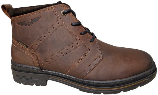 Cognackleurige leren herenboot van PME Legend met veters, wing-logo en een dikke zwarte zool.