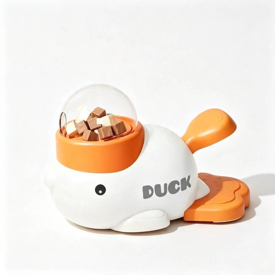Wit eendvormig snackdispenser met oranje accenten. De transparante bovenkant is gevuld met snoepjes. Tekst 'DUCK' op de zijkant.