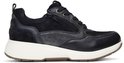 Donkerblauwe leren en suède sneaker met rits, witte zool en bruine accenten.