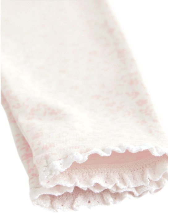 Een legging met een fijne bloemenprint en ruches aan de onderkant.