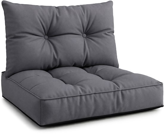 Coussin d'assise et de dossier rembourrés gris foncé, boutonnés, sur fond noir.