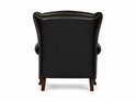 Zwarte Chesterfield fauteuil, achterkant, met gouden studs langs de rugleuning en armleuningen.
