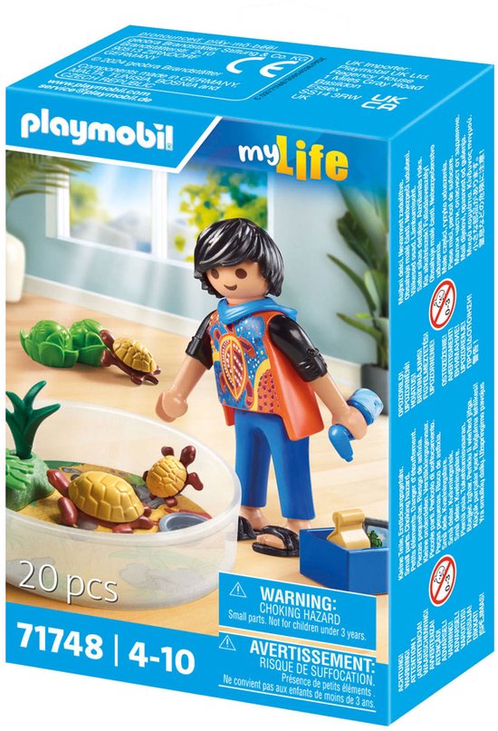 Doos van Playmobil My Life schildpadden terrarium speelgoed, met een figuur van een jongen met een oranje en blauw shirt, die blauwe attributen vasthoudt.