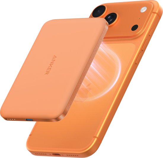 Oranje Anker magnetische powerbank naast een oranje iPhone, met de powerbank los van de telefoon.