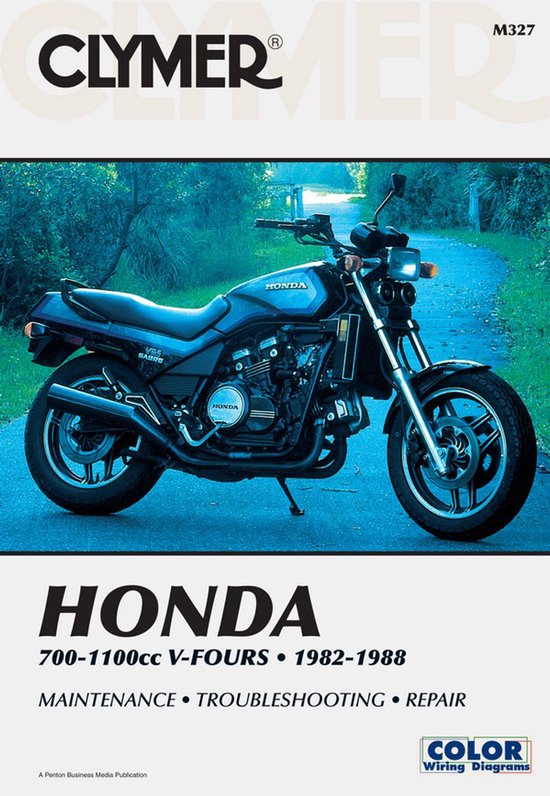 Zijaanzicht van een blauwe Honda 700-1100cc V-Four motorfiets uit 1982-1988 op een buitenpad.