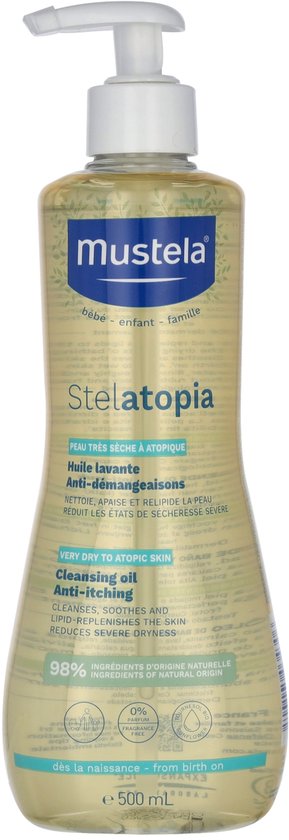Gele doucheolie in een transparante Mustela-fles met witte pomp, met een patroon van groene bladeren en zonnebloemen.