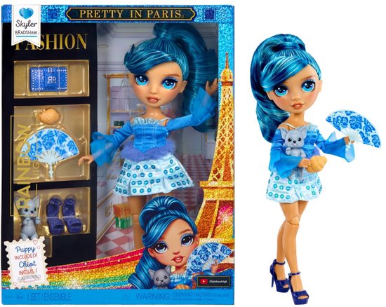 Rainbow High Skyler Bradshaw 'Pretty in Paris' pop met blauw haar, kleding, accessoires en een puppy in doos.