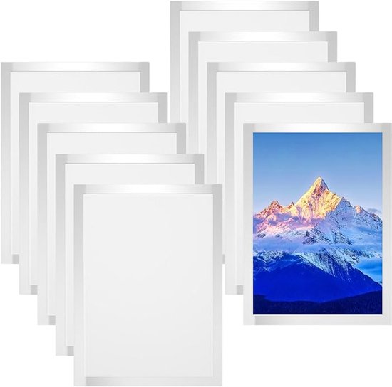 Tien witte magnetische A4-fotolijsten, één met een foto van een besneeuwde bergtop bij zonsopgang.
