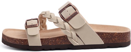 Zijaanzicht van beige sandalen met gevlochten bandjes en gespen.