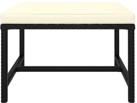 Banc en rotin noir avec coussin crème.