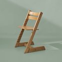 Houten Tripp Trapp kinderstoel in natuurlijke kleur met verstelbare zitting en rugleuning.