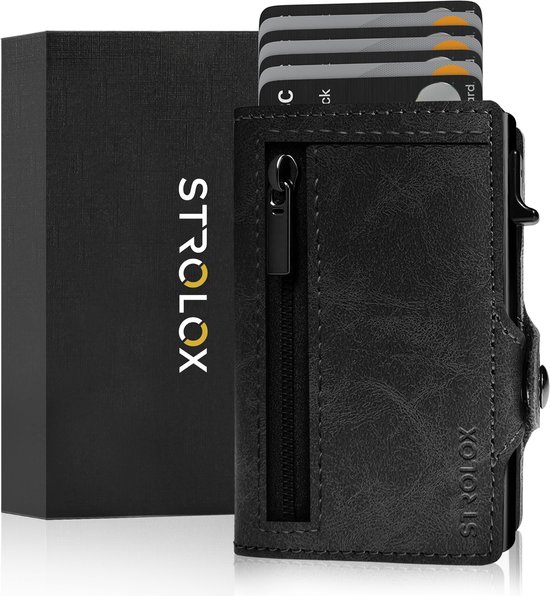 Porte-cartes noir en cuir avec fermeture éclair et cartes éjectées, à côté d'une boîte cadeau noire avec 'STROLOX'.
